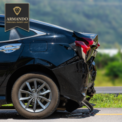 After an accident in Plant City, a black sedan stopped on the roadside with rear-end damage