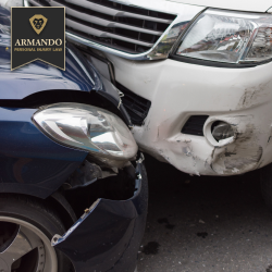A white car and a blue car with front-end collision damage after a car accident in Temple Terrace, FL