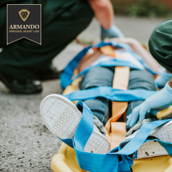 An emergency responder secures the injured person on a stretcher with safety straps after an accident in Clearwater, FL