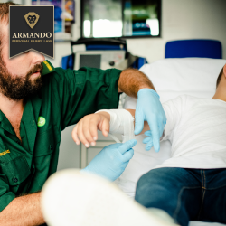 A paramedic wrapping an injured person’s arm while they lie on a hospital bed near Palm Harbor, Florida