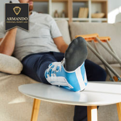 After an accident in Pinellas Park, an injured man rests with his leg in a medical boot and crutches nearby