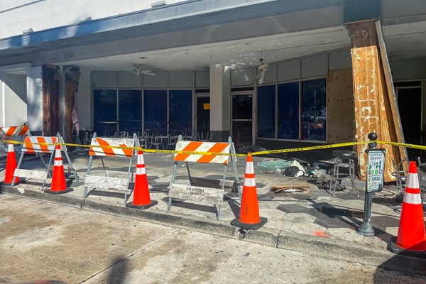Barricades, traffic cones, and caution tape on 7th Avenue in Ybor City after a deadly crash, showing the area secured in the aftermath.