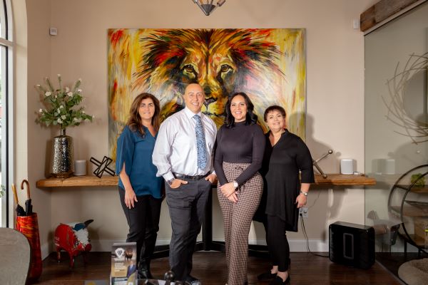 The Armando Personal Injury Law team standing in their Tampa office, located at 2002 E 5th Ave, UNIT 103.