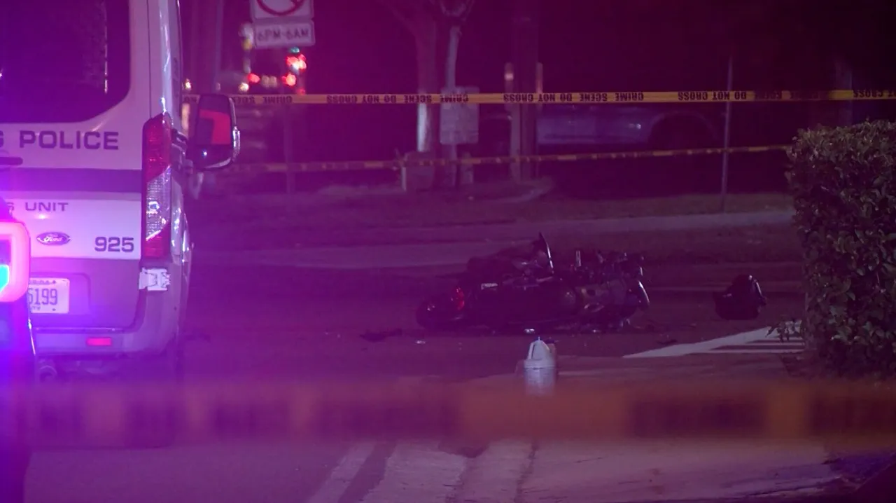 St. Petersburg police cruiser and motorcycle crash scene near 54th Avenue North and 16th Street North