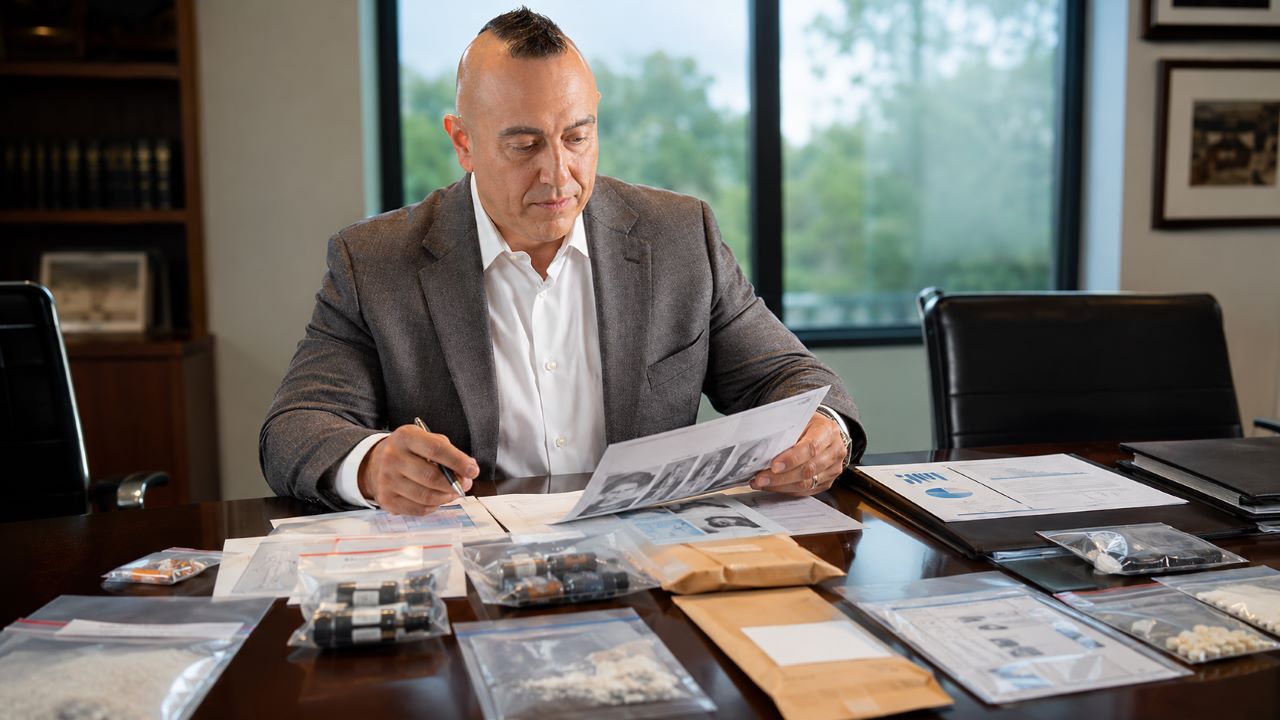 Attorney reviewing toxicology records and product evidence in a Florida 7-OH death case