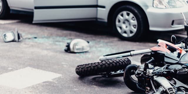 Damaged motorcycle on ground after motorcycle accident in Tampa