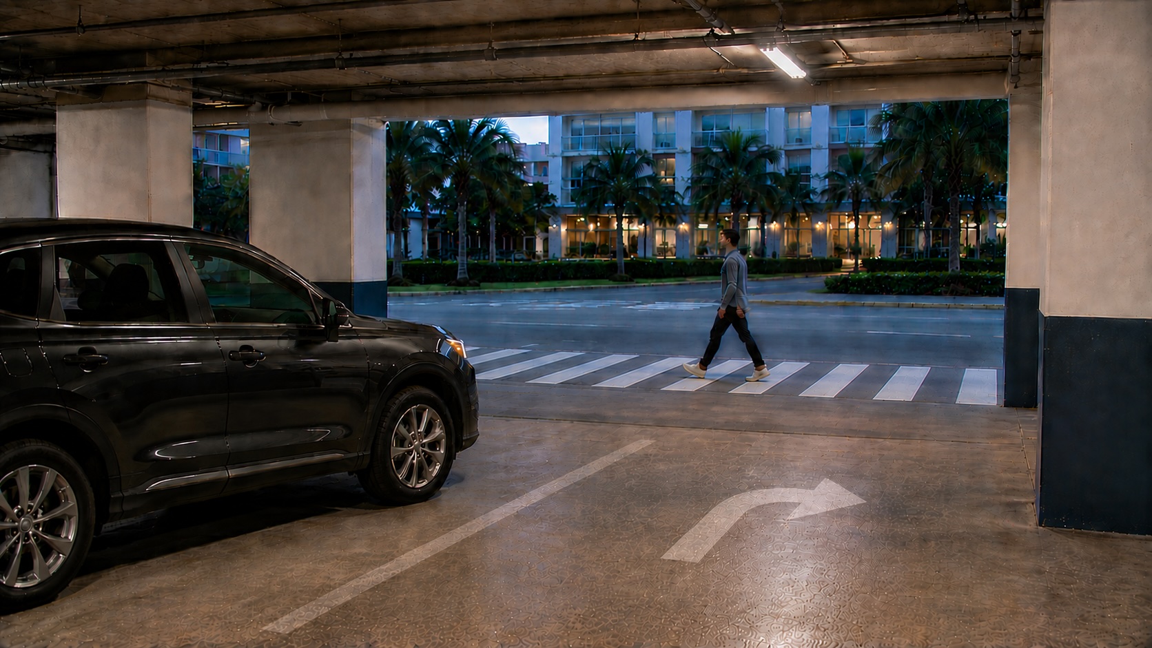 Vehicle approaching a pedestrian walkway at a Tampa parking garage exit.